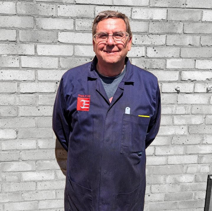 picture of andy smiling in triple e engineering uniform