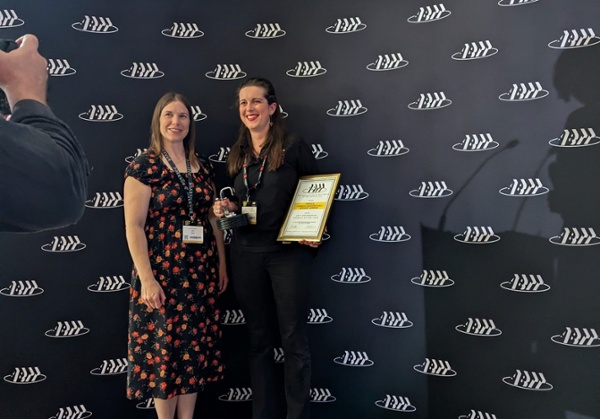 Lucy receiving award